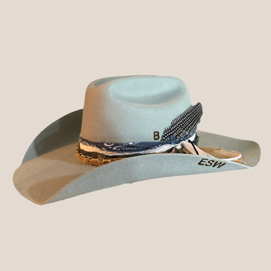 Grey Cowgirl Hat with Bands and Branding on a Cream Background